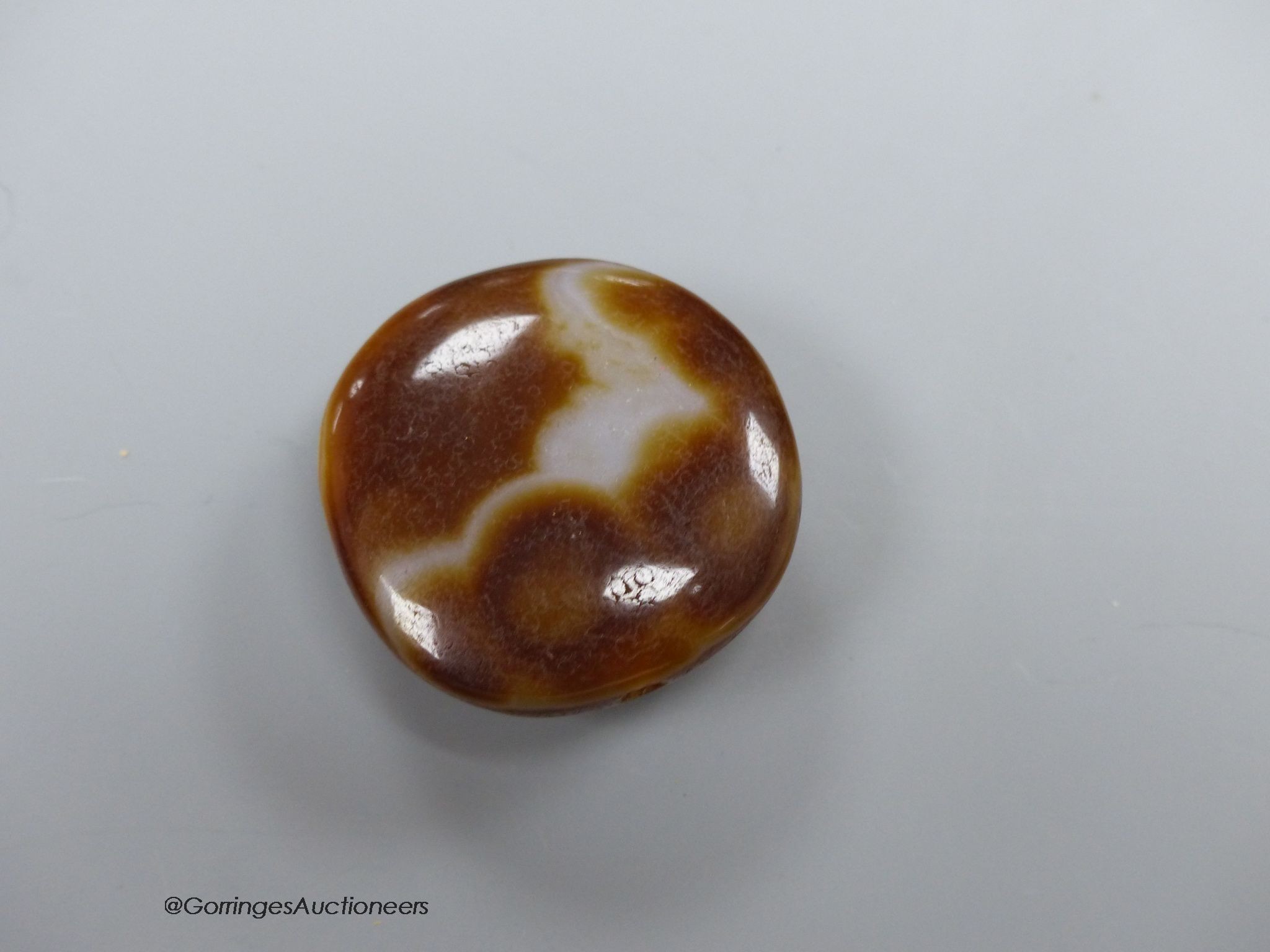 A cased agate pendant